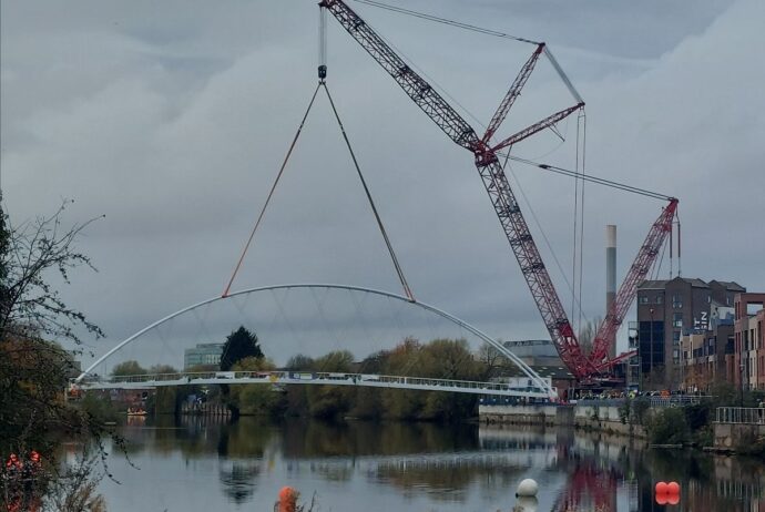 The new bridge being lifted into place